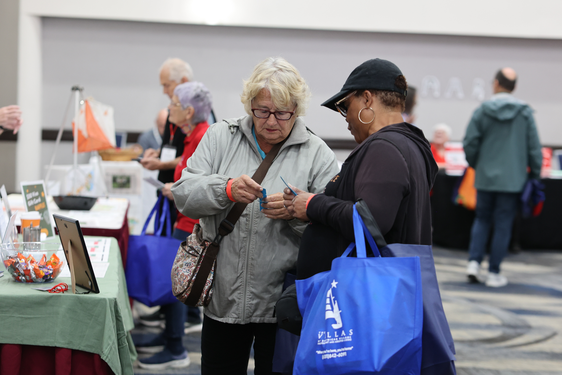 Two attendees look to see if they won a raffle prize
