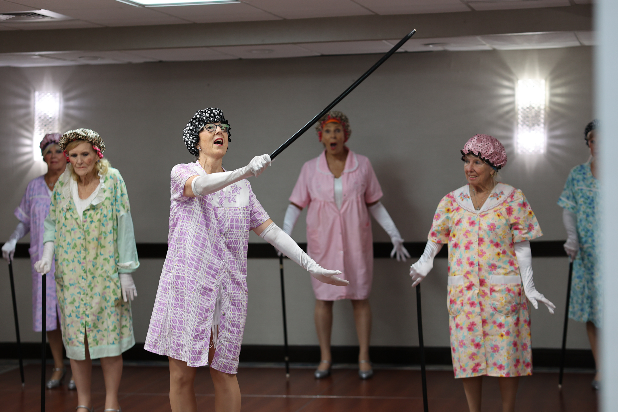 Women in costumes from the Seasoned Steppers dance troupe